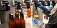 Is Manual Bottle Labeling Slowing Your Production?